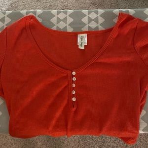 Dippin Daisy red body suit. Express